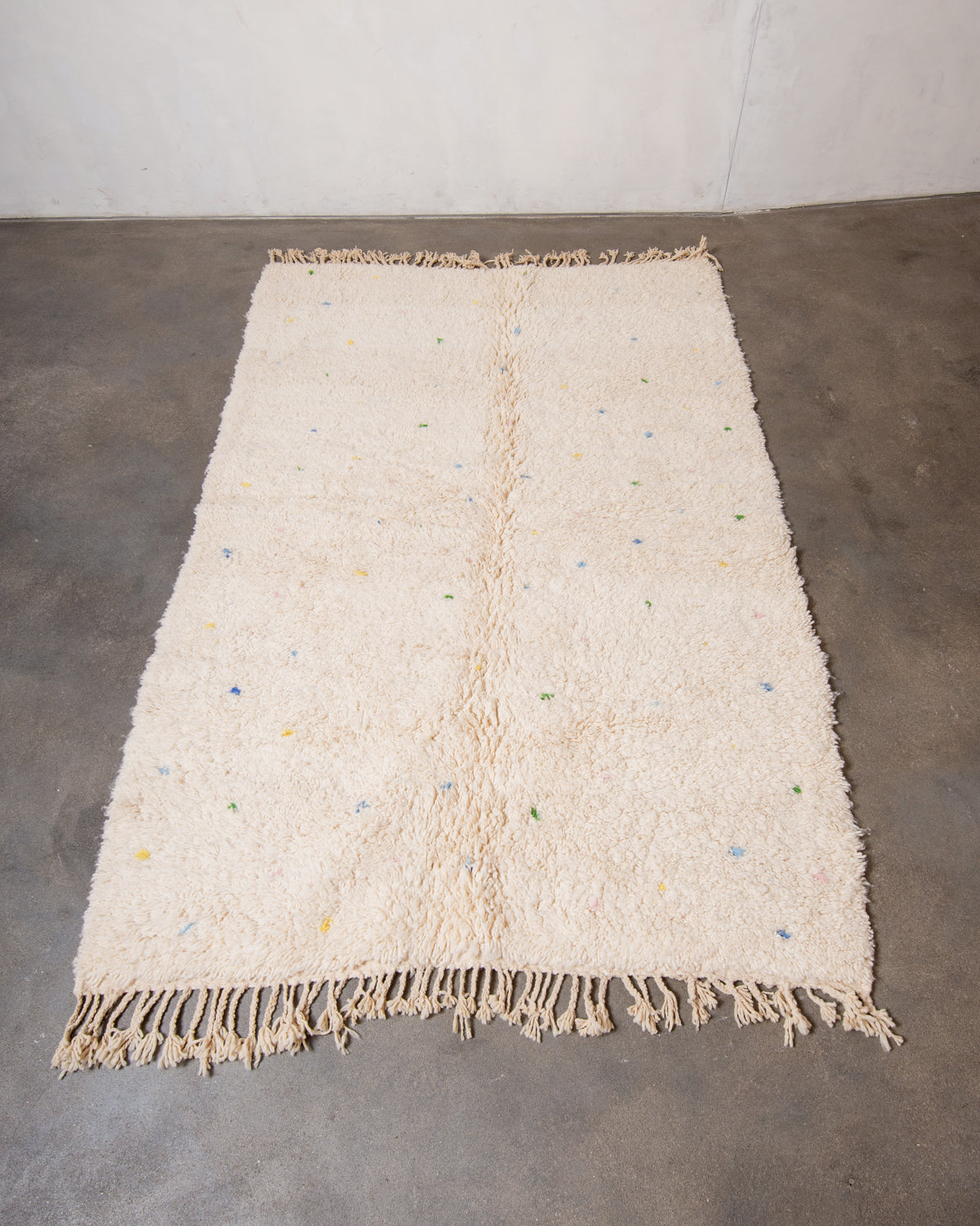 Modern, designer, handcrafted Berber rug from Morocco. Beniourain carpet with beautiful colours and patterns and fluffy wool texture.